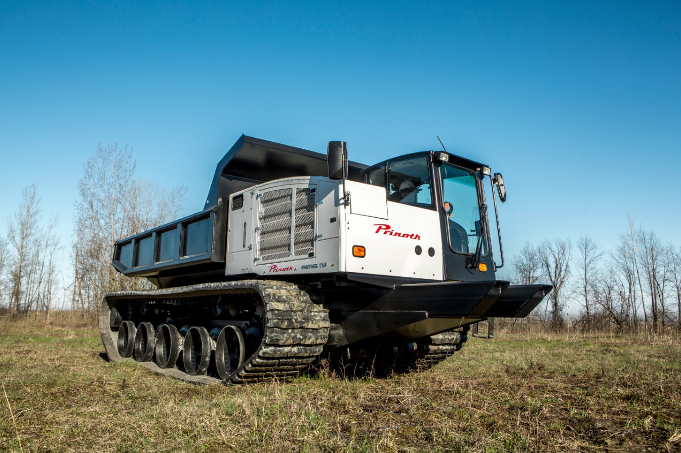 Tracked utility vehicle offers metal embedded solid rubber tracks